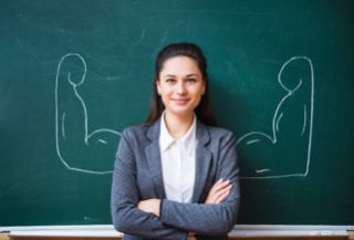 teacher at blackboard